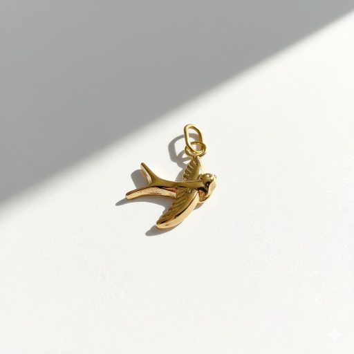 Fecske charm, aranyozott